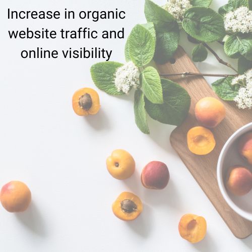 peaches and apricots on a table with flowers