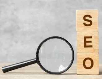 magnifying glass with blocks vertically spelling seo